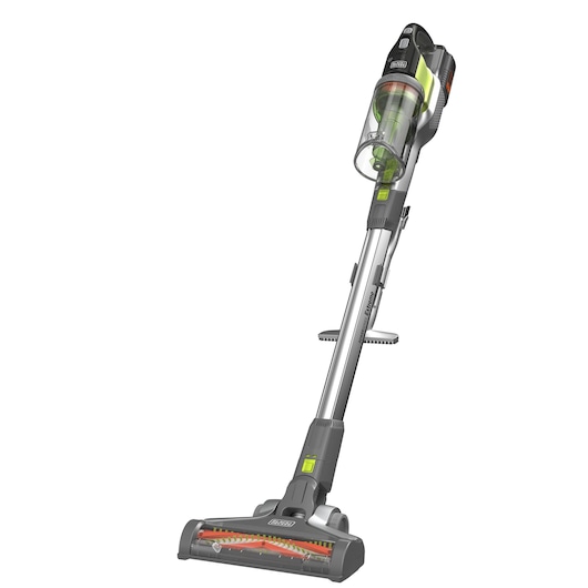 BLACK+DECKER snoerloze steelstofzuiger met een transparante stofcontainer, schuine borstelkop en grijze en groene kleuraccenten, getoond tegen een witte achtergrond.