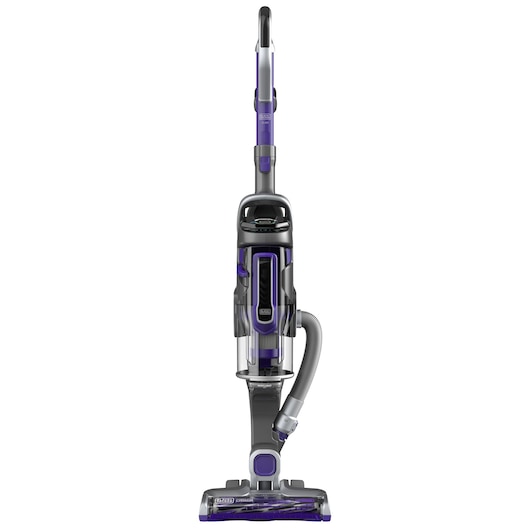 Aspirateur vertical avec un réservoir à poussière transparent, un tuyau détachable et un design violet et gris, présenté en position debout.