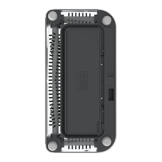 Vue de dessus d’un accessoire de photographie BLACK+DECKER PSA215B, montrant sa forme rectangulaire, son couvercle sombre avec le logo de la marque et les rouleaux de brosse cylindriques visibles aux deux extrémités.